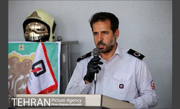 آیین پرچم گردانی حرم امام رضا در ایستگاه آتشنشانی 9