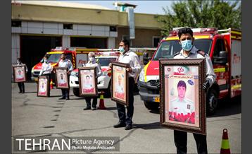 آیین پرچم گردانی حرم امام رضا در ایستگاه آتشنشانی 2