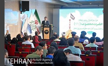 اهتزاز پرچم حرم حضرت معصومه (س) در برج میلاد 6