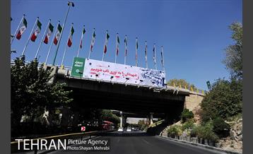 نصب تصاویر مربوط به دوران دفاع مقدس در معابر پایتخت 11