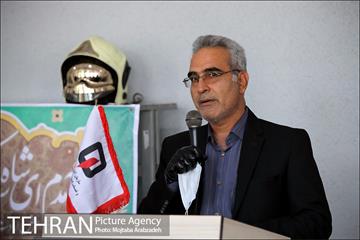 آیین پرچم گردانی حرم امام رضا در ایستگاه آتشنشانی 18