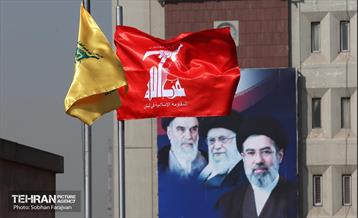 اهتزاز پرچم حزب الله بر بام بلدیه 14