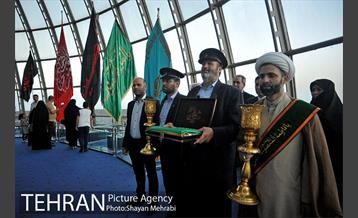 اهتزاز پرچم حرم حضرت معصومه (س) در برج میلاد 18