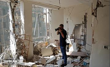 بازدید اصحاب رسانه از بازسازی ساختمان‌های آسیب‌دیده جنگ 12 روزه 30