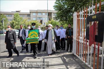 آیین پرچم گردانی حرم امام رضا در ایستگاه آتشنشانی 3