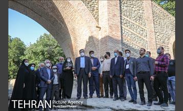 آیین بهره برداری از پروژه مرمت و احیاء پل آجری تاریخی و ثبتی کن 21