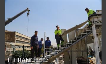 رفع خطر طبقه سوم پاساژ 102 در خیابان امام خمینی(ره)  12