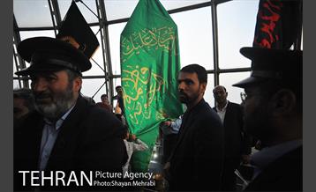 اهتزاز پرچم حرم حضرت معصومه (س) در برج میلاد 26