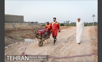 عملیات تخلیه آب از شهرک پیام اهواز 10