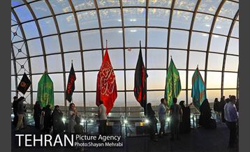 اهتزاز پرچم حرم حضرت معصومه (س) در برج میلاد 25